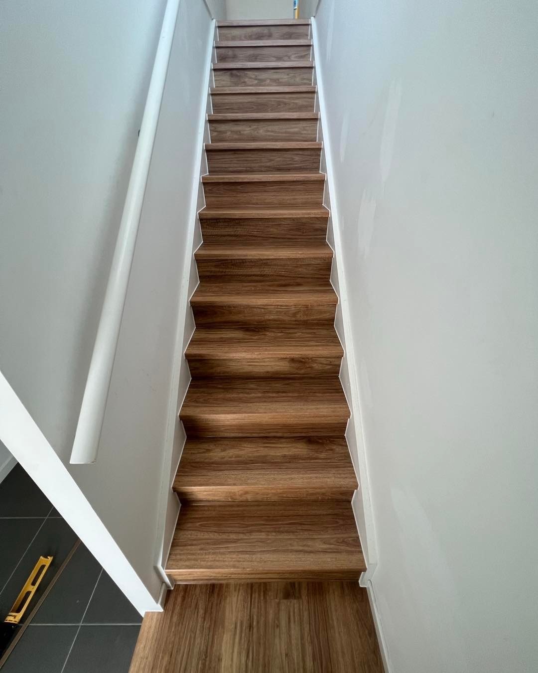 Timber stair treads and white risers