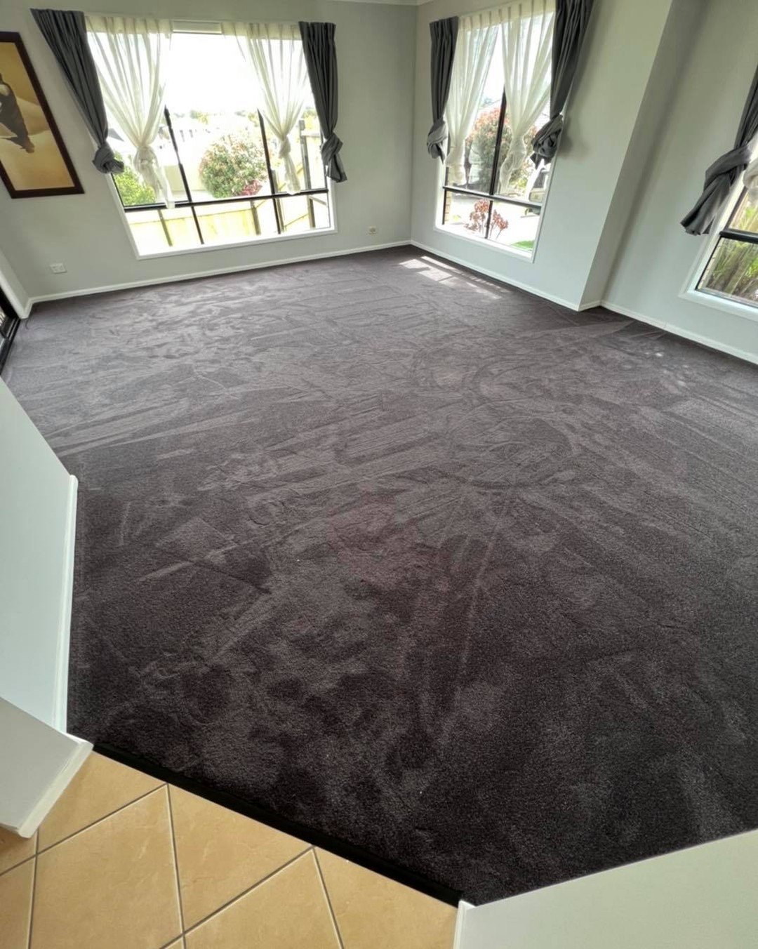 Charcoal carpet through a living room
