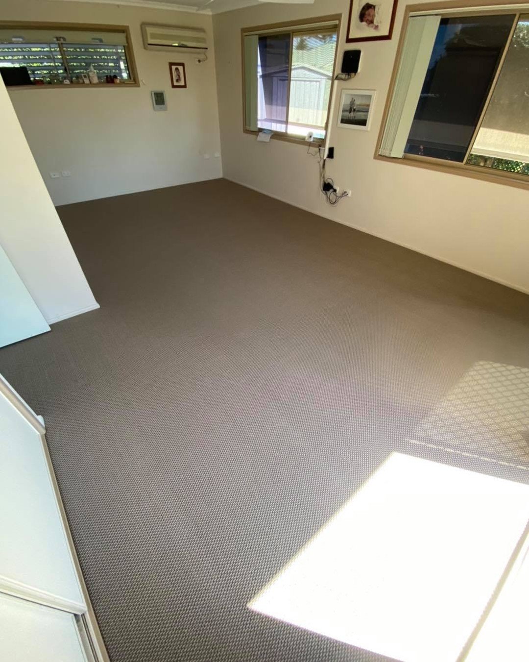 Neutral carpet in a bright living room