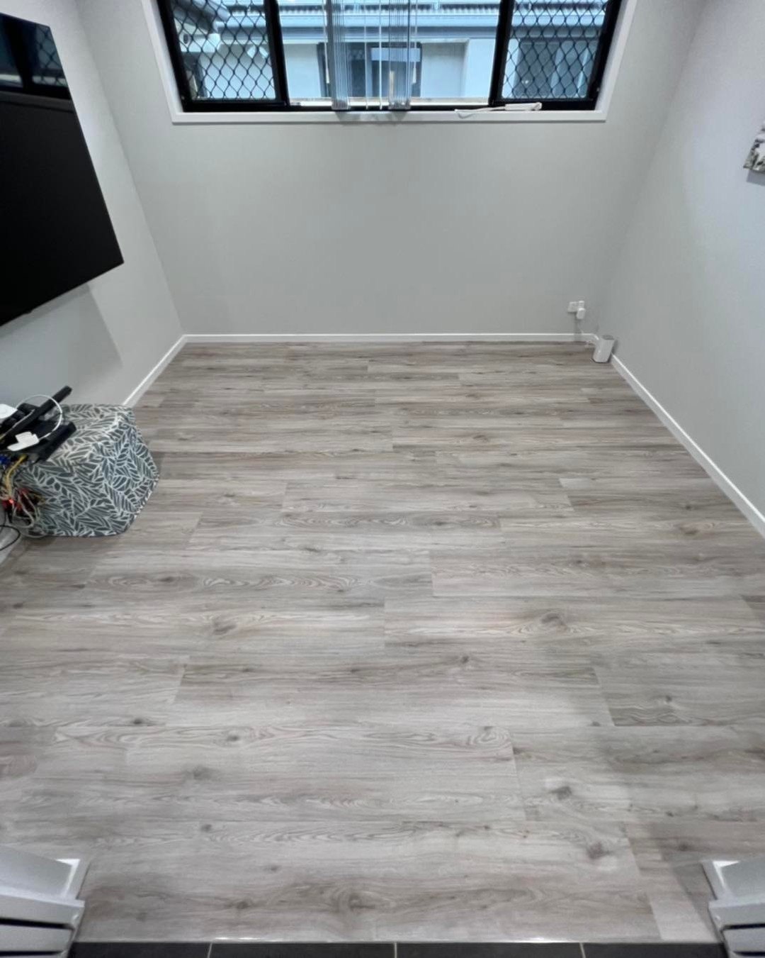 Grey plank through an open area